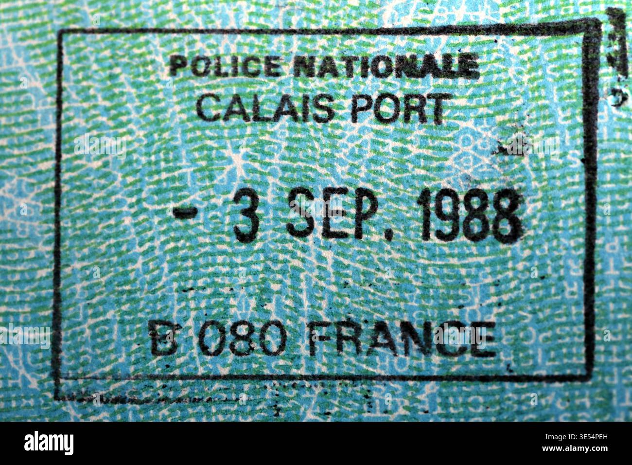 Close-up of a Calais Port passport stamp dated 3 October 1988, showing French Police Nationale immigration marking on a passport page Stock Photo