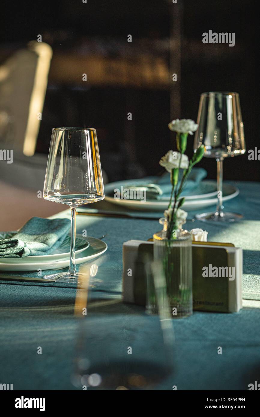 Elegant restaurant table setting with glassware Stock Photo