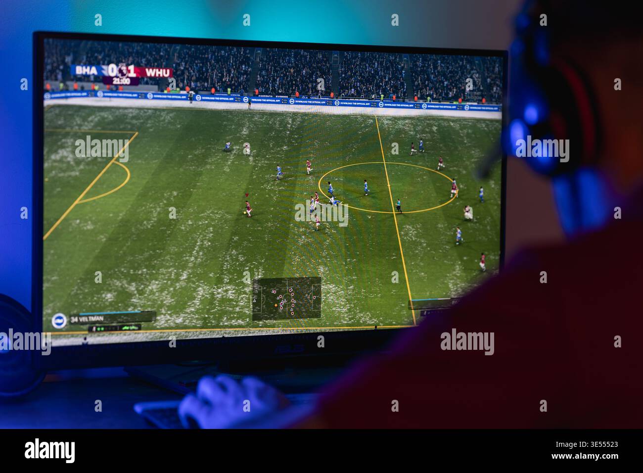 Gamer playing football simulation hi-res stock photography and images ...