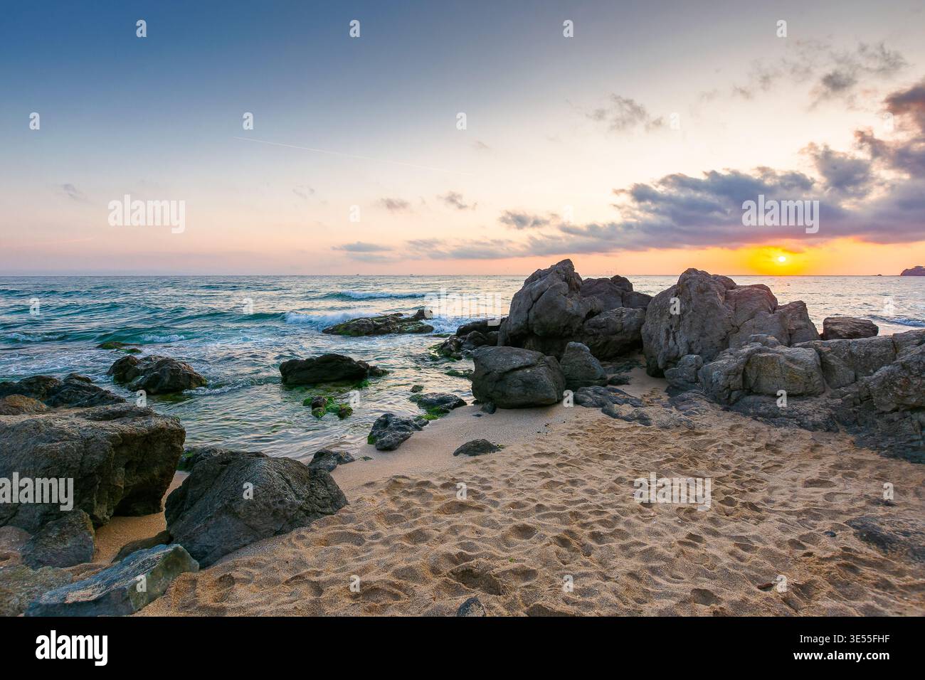 sunrise over sandy beach landscape. coastal seascape scenery of southern bulgaria, sozopol. nature background for summer vacation at the shore of blac Stock Photo