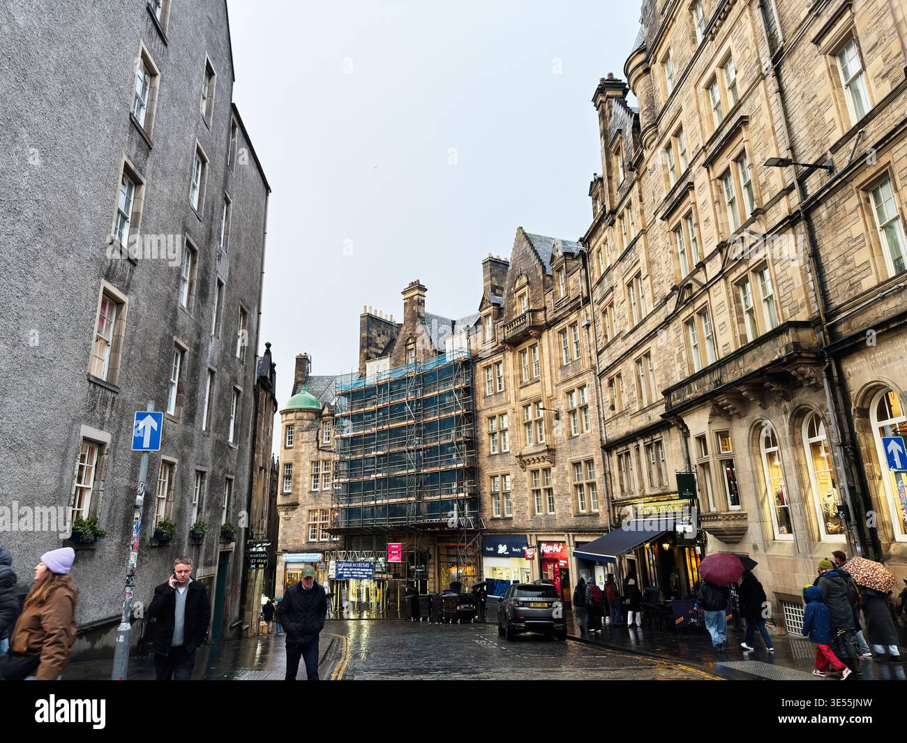 Edinburgh, Scotland, UK - February 15, 2026: Pedestrians walk on wet ...