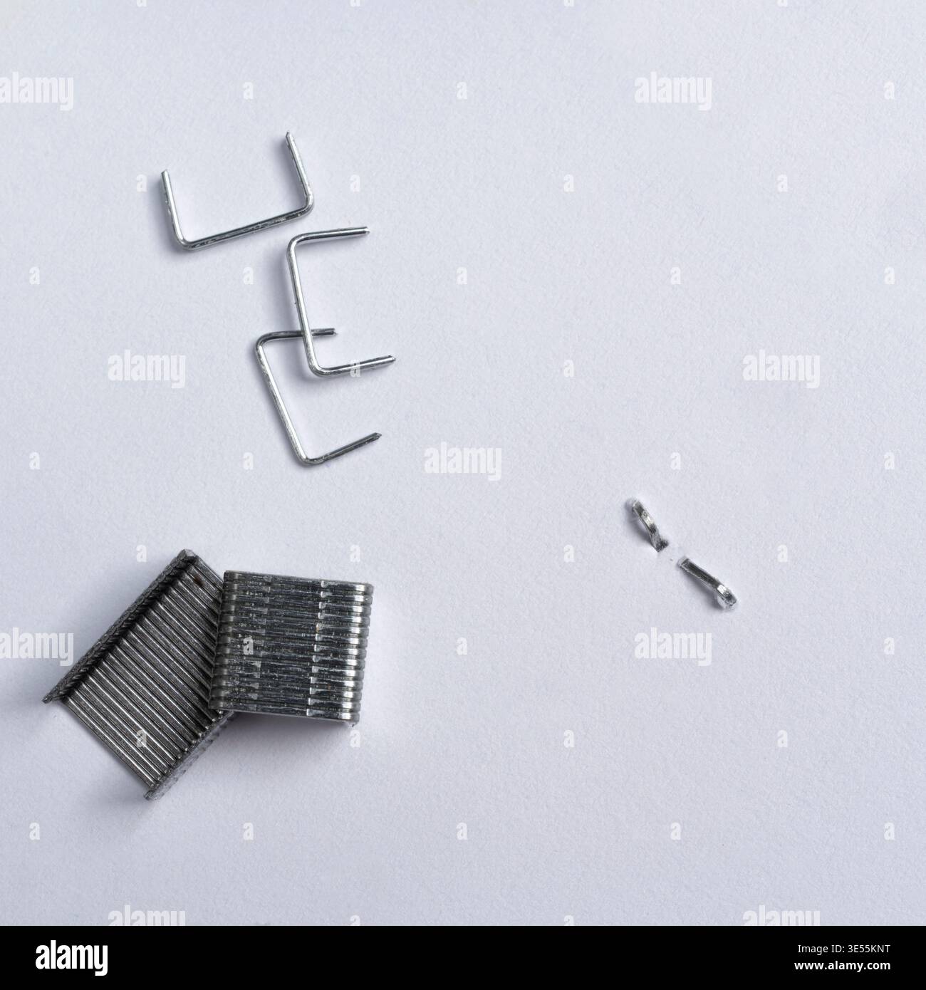 isolated staples on a white surface Stock Photo