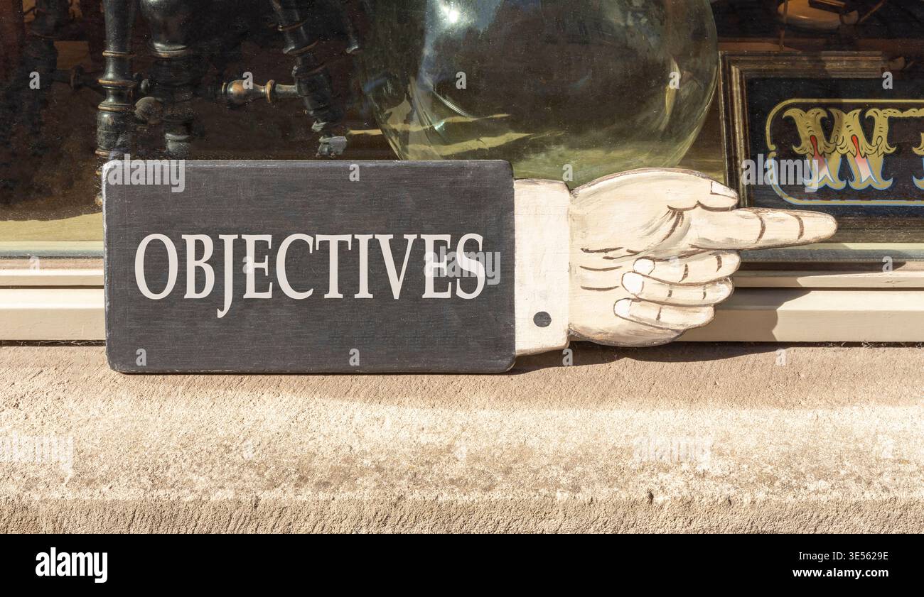 Objectives symbol. Concept word Objectives on beautiful black wooden ...