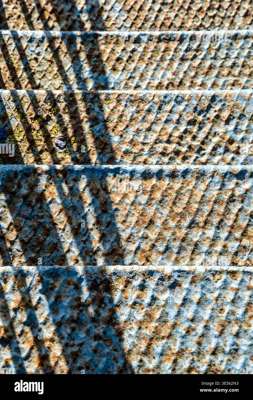 old, blue, rusty stairs going down Stock Photo