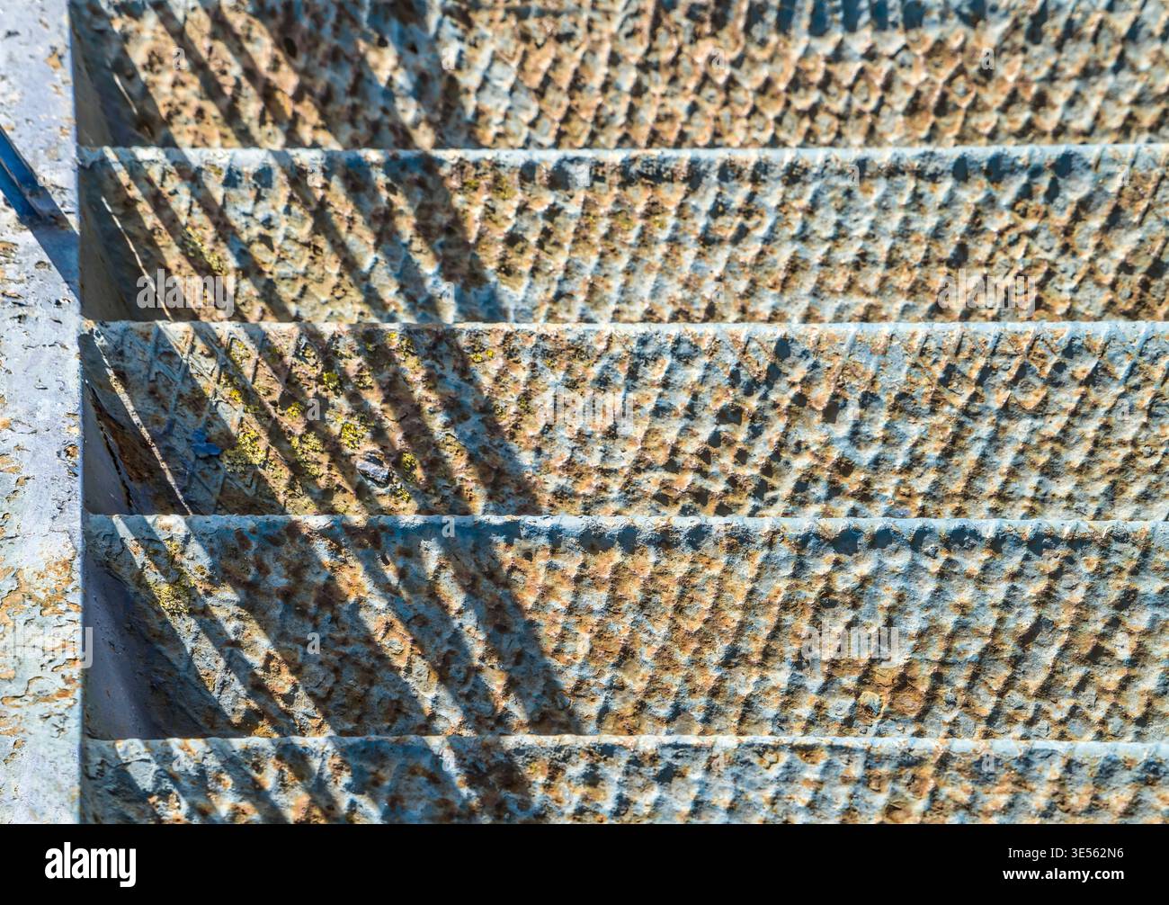 old, blue, rusty stairs going down Stock Photo