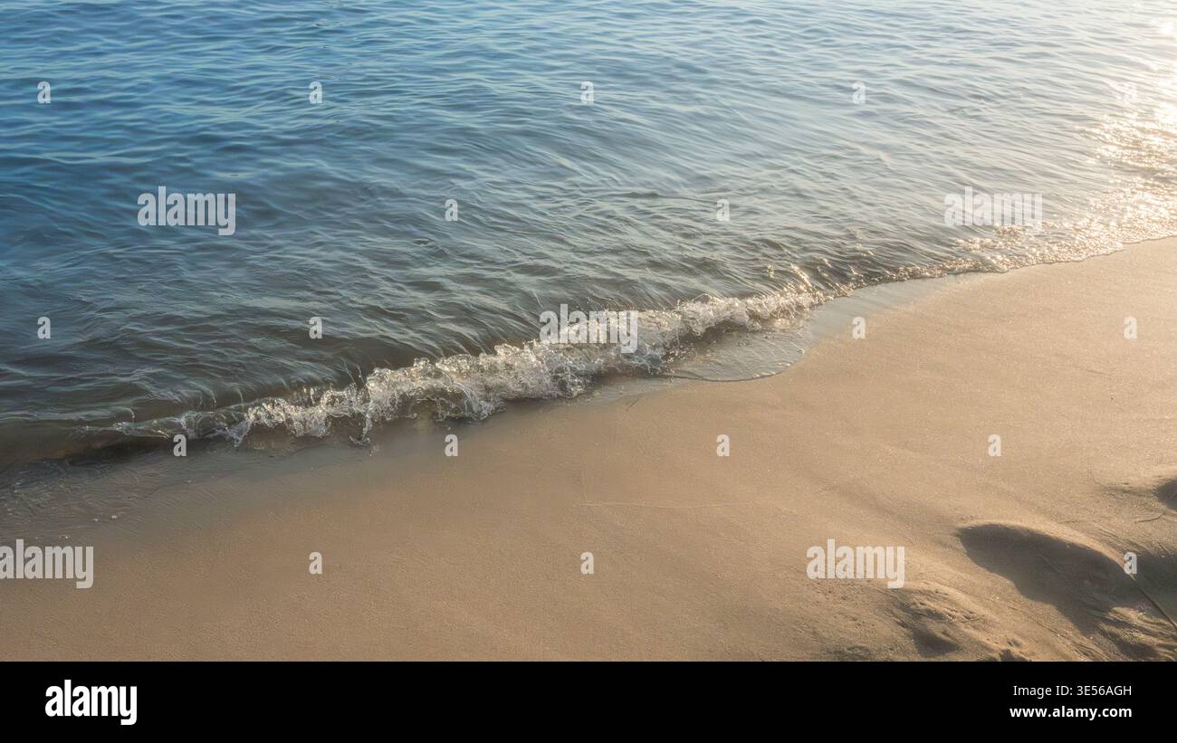 Soft beautiful ocean wave on sandy beach. Background. Stock Photo
