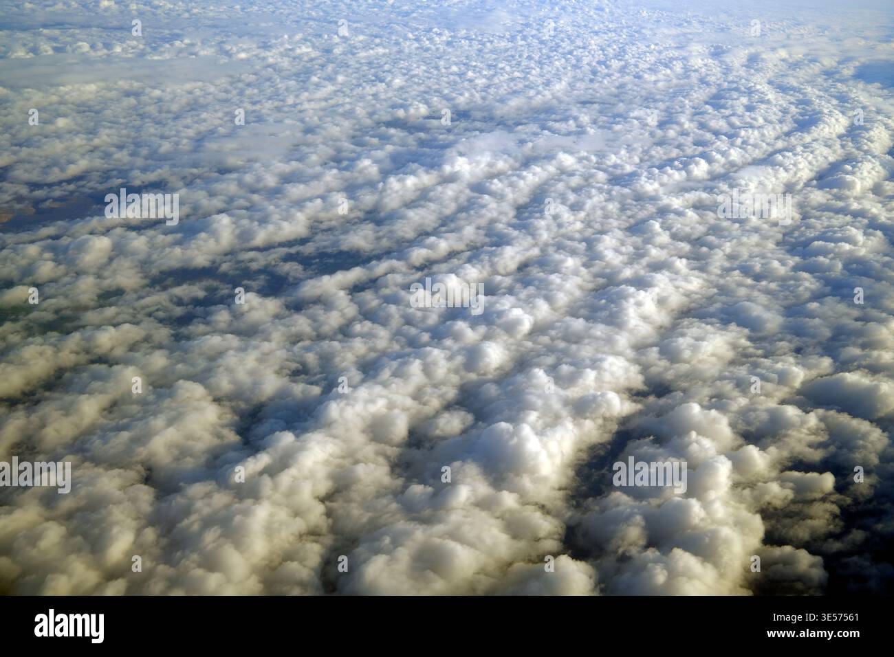 Undulating De Formation Overhead vista of undulating cumulus formations, soft peaks and valleys ...