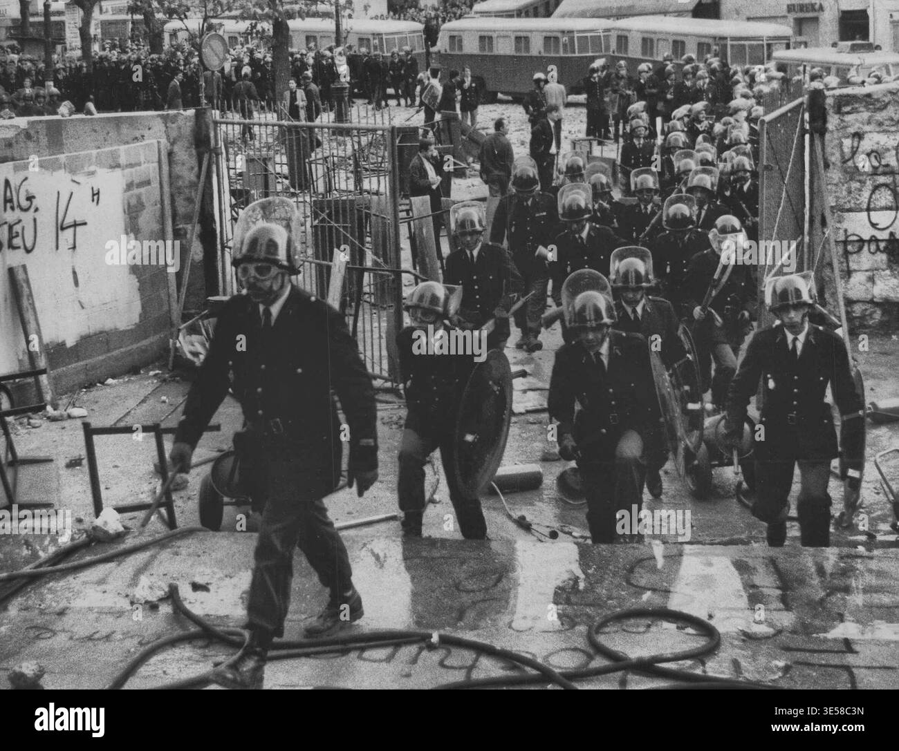 Army Riot Police Evacuating Army - An army of riot police, wielding sticks carrying ...