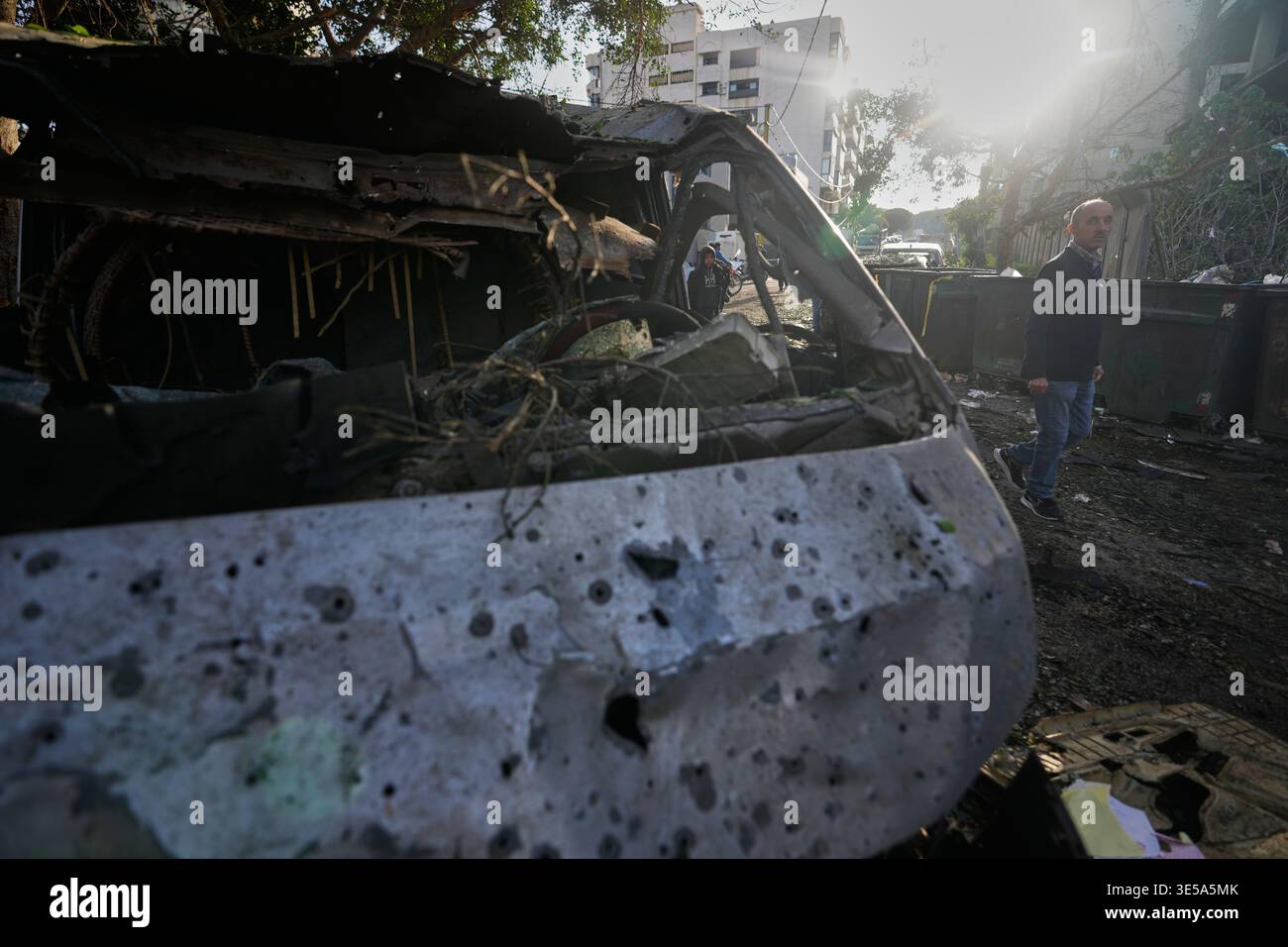 Damage Types Shrapnel A man walks past a vehicle riddled with shrapnel damage following an ...