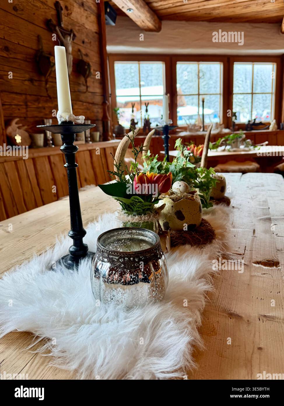 A beautifully decorated wooden dining table inside Stock Photo