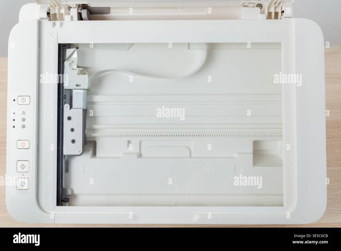 Flatbed scanner bed inside a multifunction office printer shown from ...