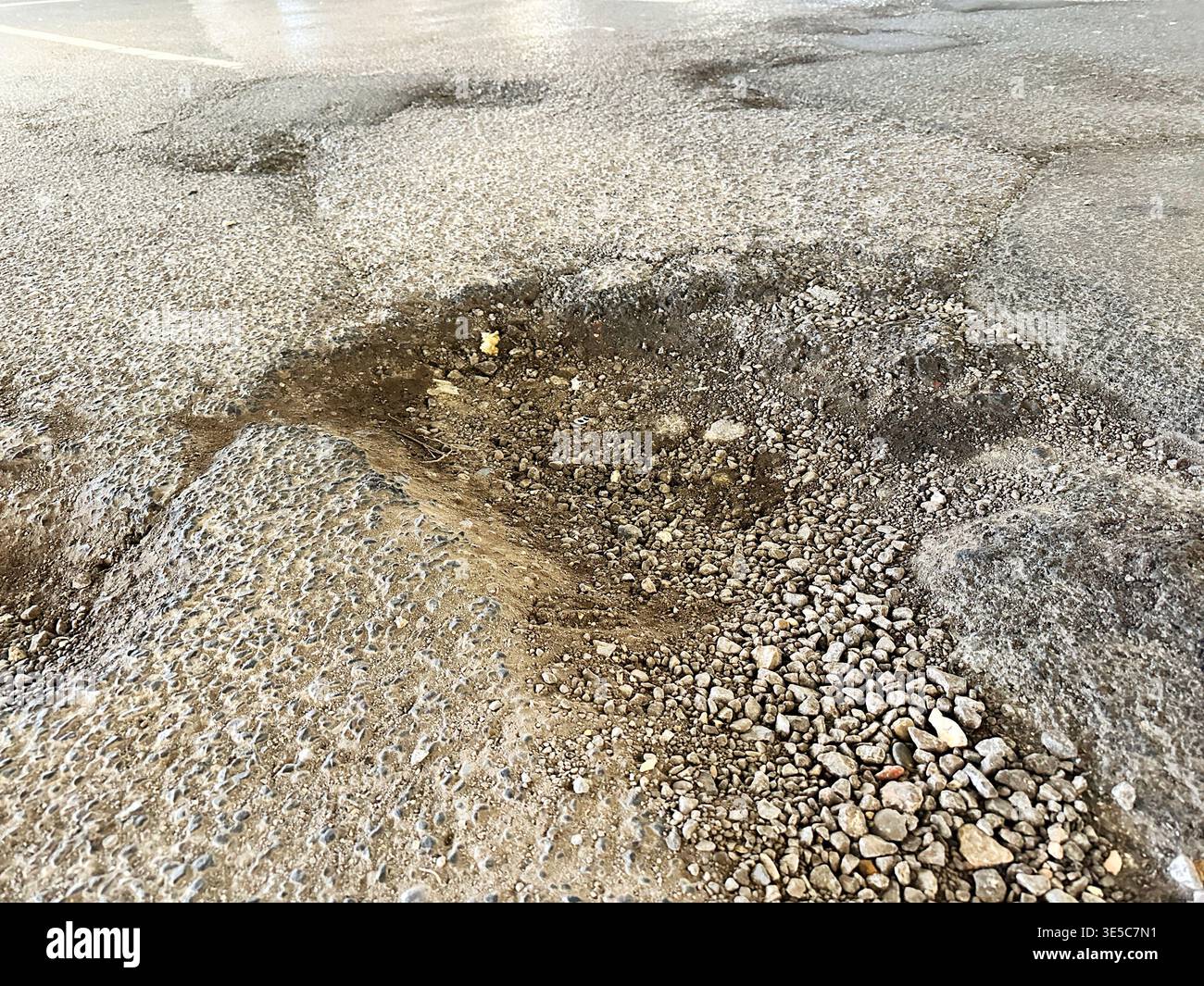 Pothole - Pot hole Stock Photo