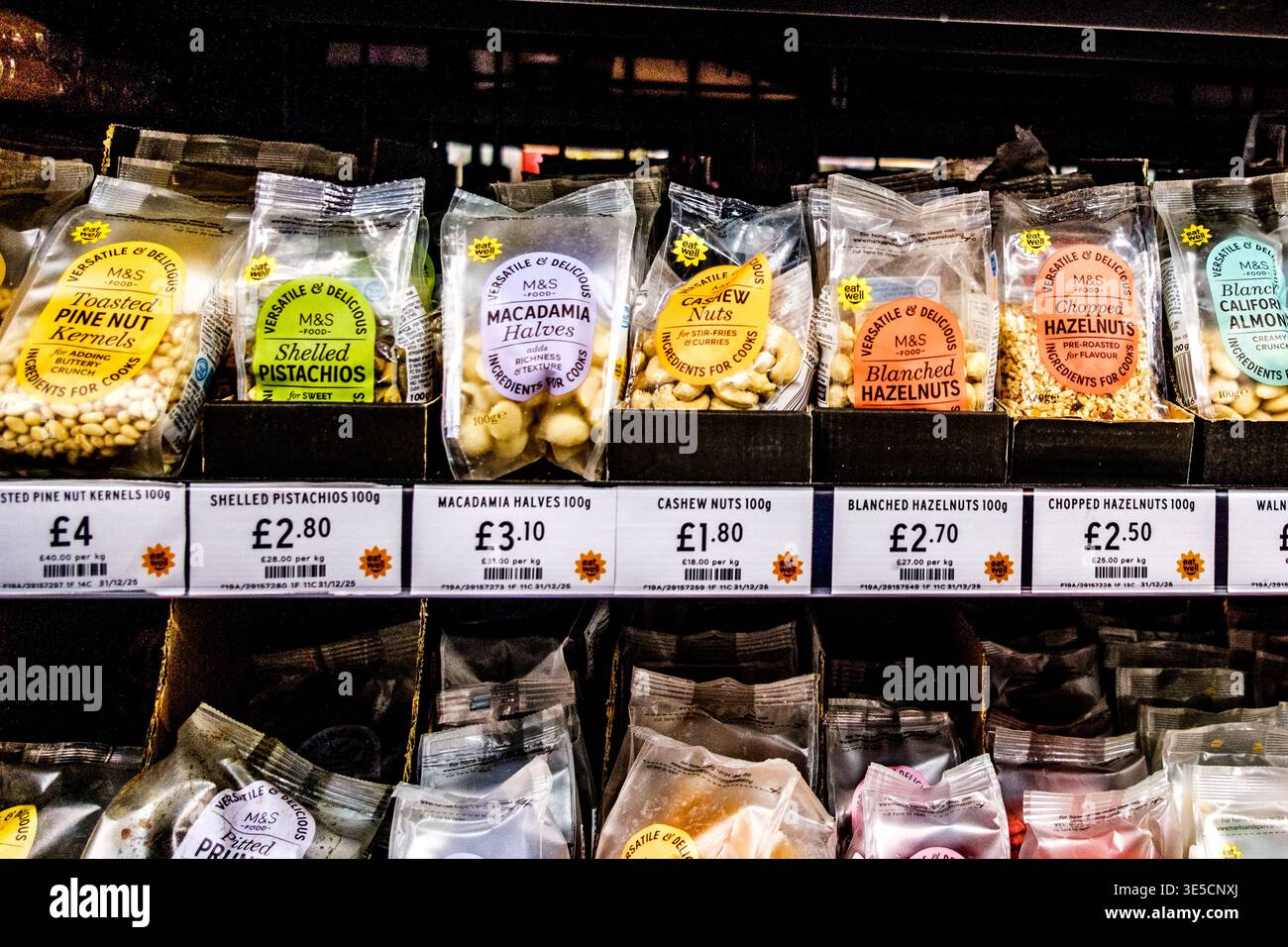 London UK, April 01 2026, Supermarket Selection of Healthy Nuts Snacks and Cooking Ingredients Stock Photo