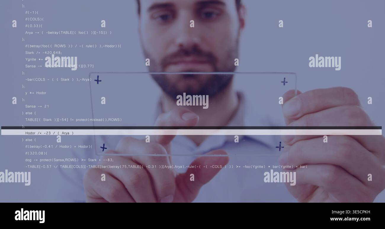 Manipulating man in collared shirt using glass panel in studio with floating code and UI markers Stock Photo