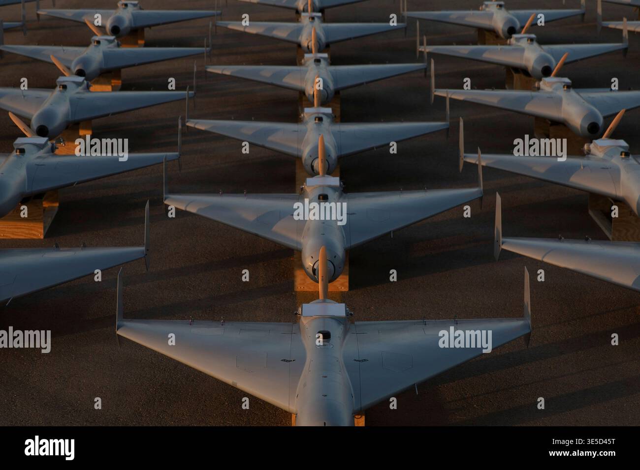 Undisclosed Location, United States. 23 November, 2025. LUCAS or Low-cost Unmanned Combat Attack System drones are positioned on the tarmac at a base in the U.S. Central Command operating area, November 23, 2025 at an Undisclosed Location. The LUCAS drone was developed by SpektreWorks by reverse engineering the Iranian HESA Shahed 136 drone.Credit: Handout/U.S Air Force Photo/Alamy Live News Stock Photo