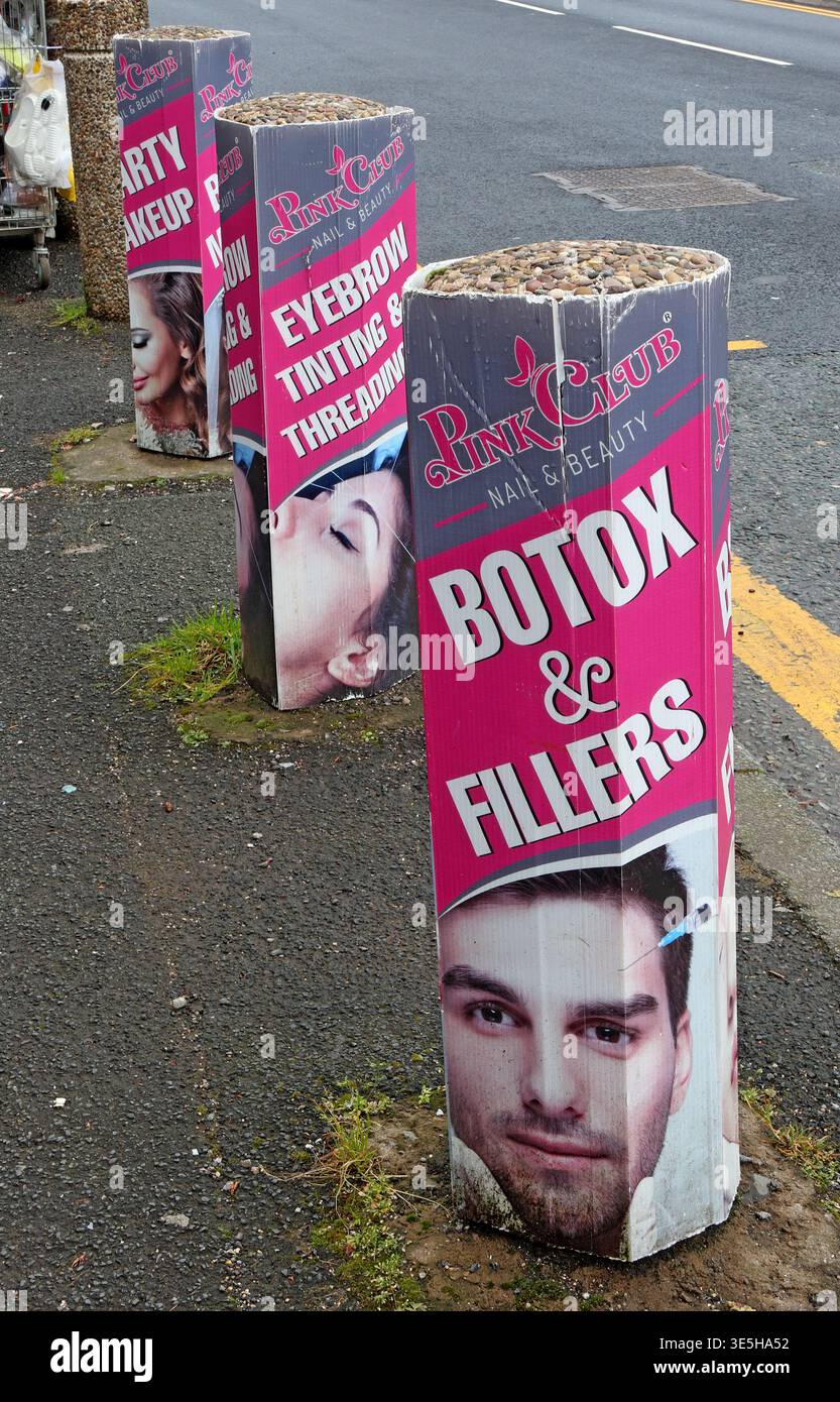 Botox and fillers advertising boards on a pavement in Trafford, Greater Manchester, England, UK. Stock Photo