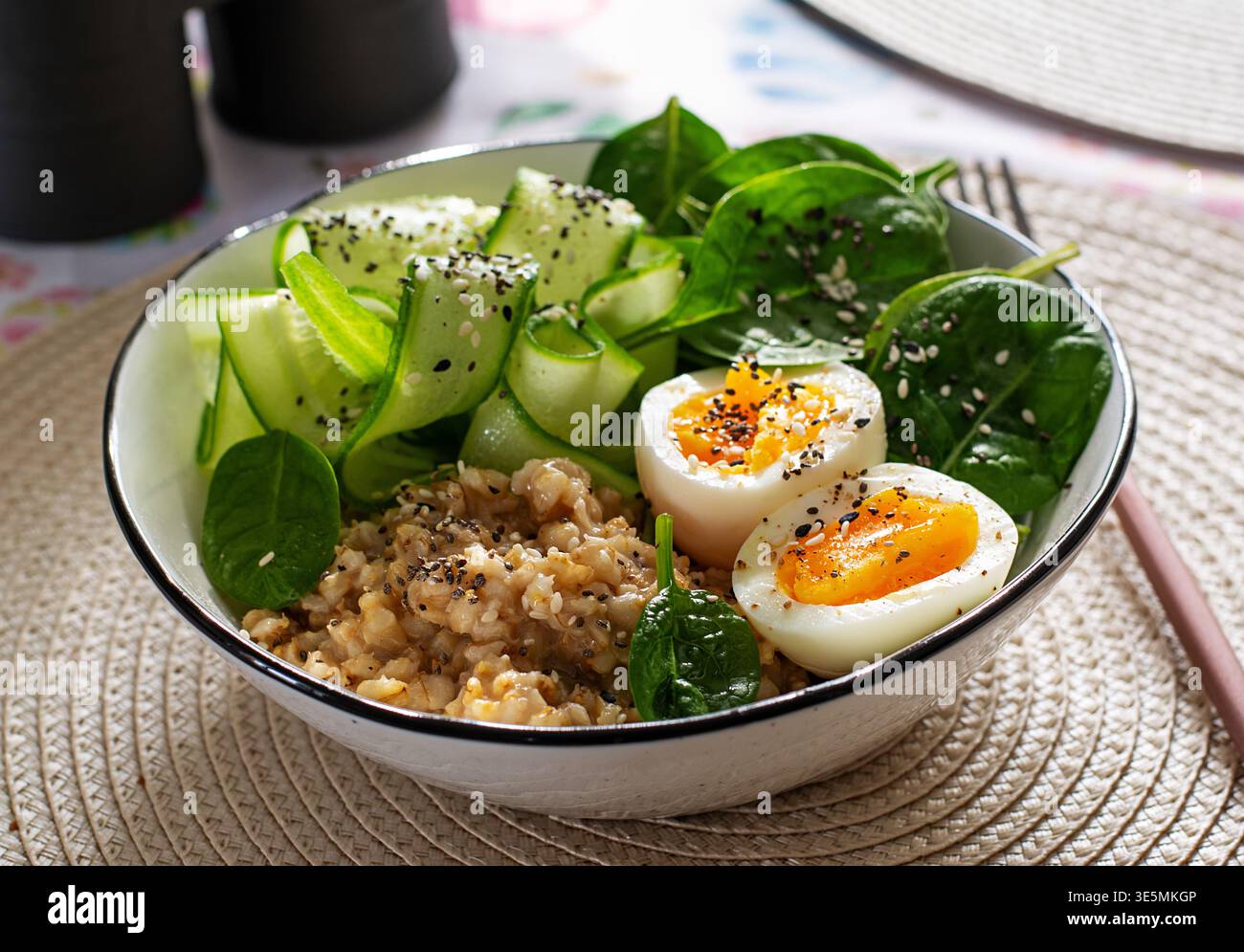 Clean Eating Breakfast with Oatmeal Greens and Soft Boiled Egg Stock Photo
