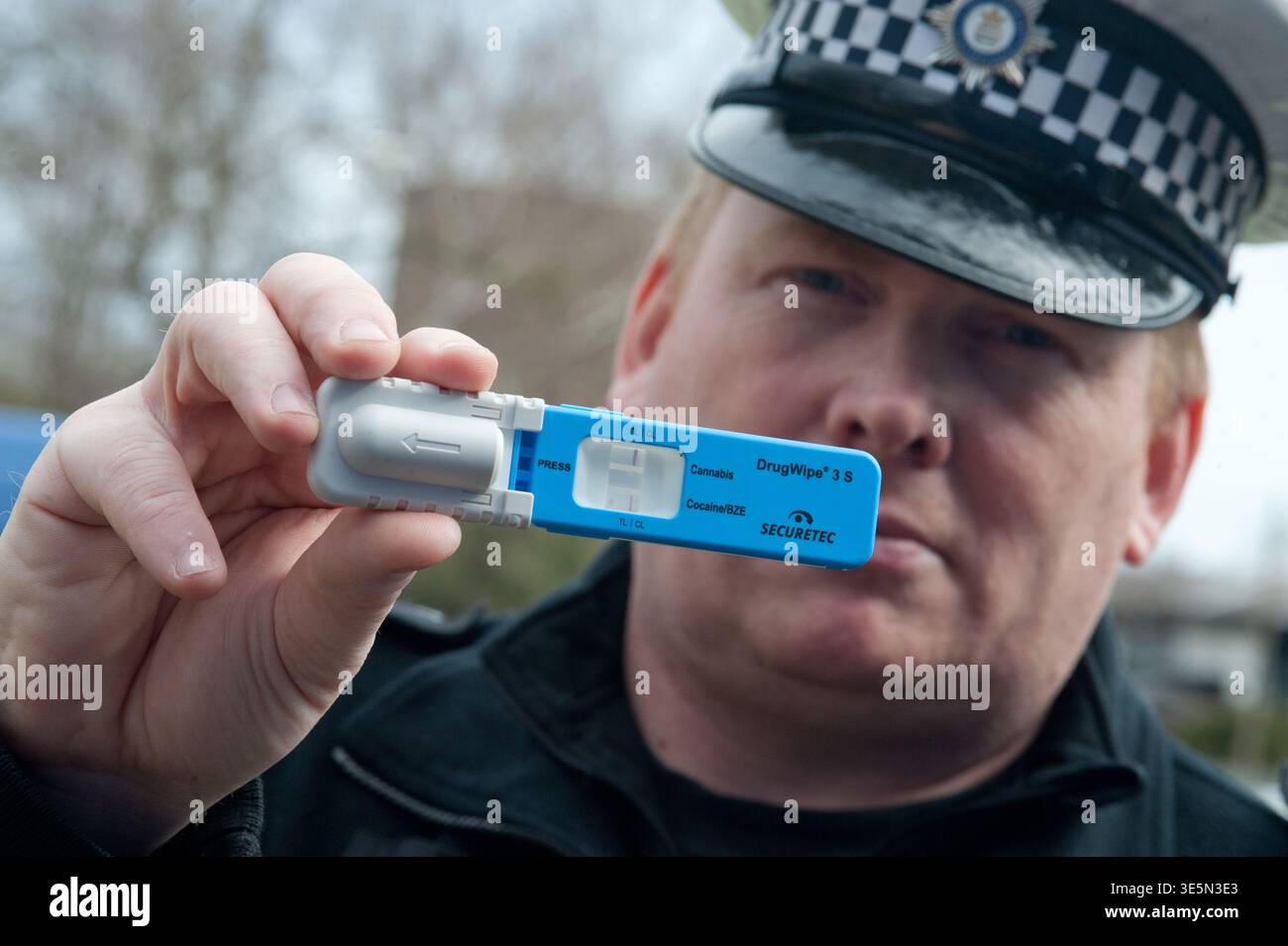 Roadside Test UK police officers conducting a roadside test for cannabis or cocaine ...
