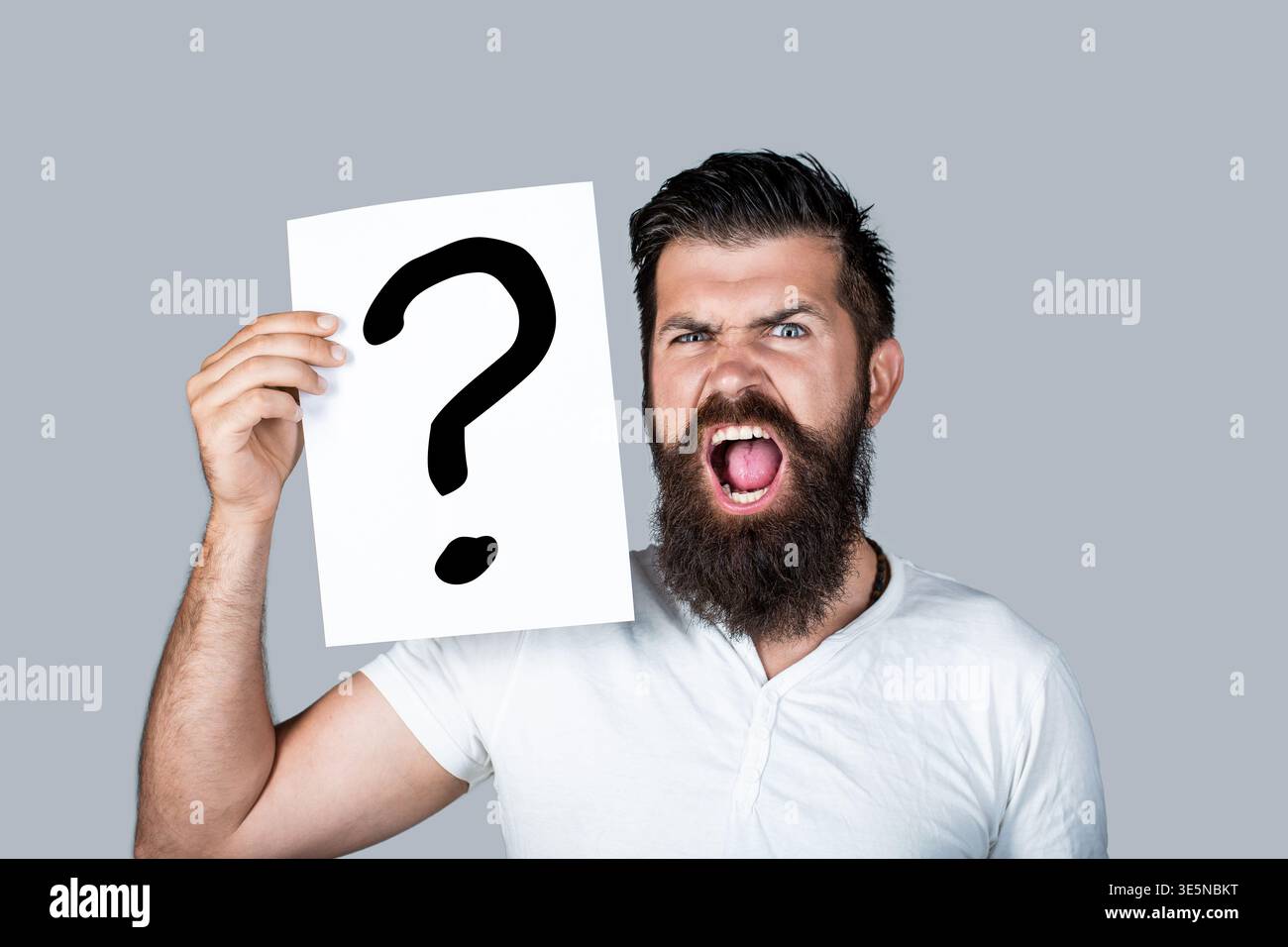 Paper notes with question marks. Confused male thinking with question mark. Scream man with question mark. Doubtful man asking questions to himself Stock Photo