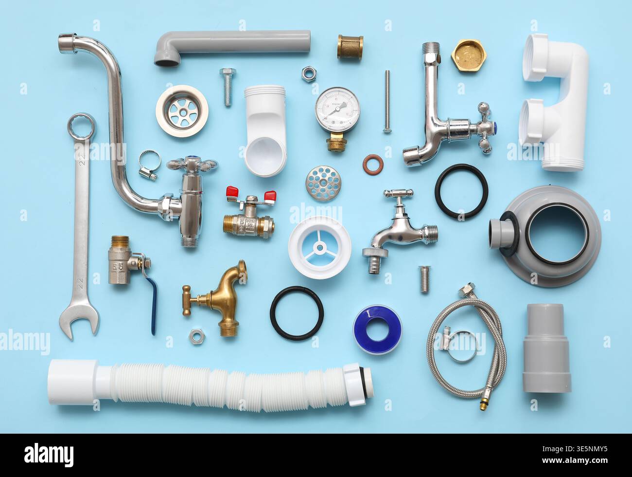 Composition with plumber's items on blue background Stock Photo