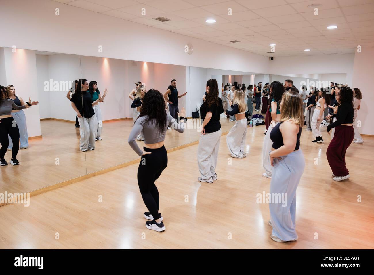 Dance class rehearsing choreography in a professional studio Stock Photo