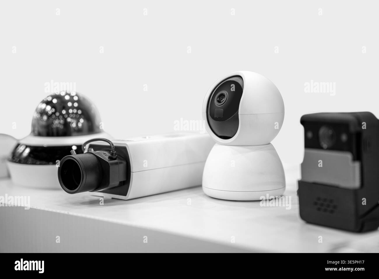 Modern IP CCTV security cameras on white background. Stock Photo
