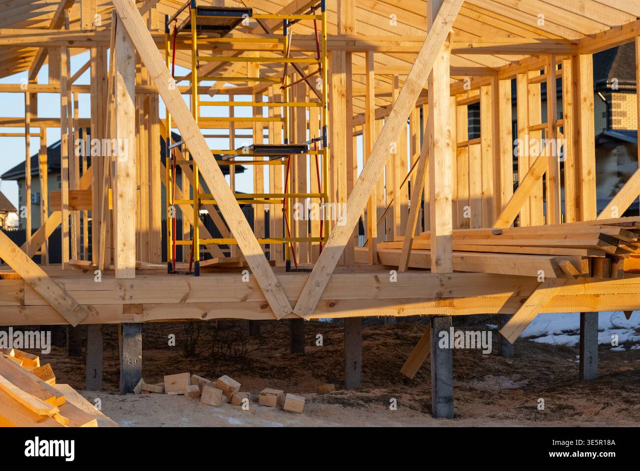 Foundation view of timber frame house, wooden beams, structure support ...