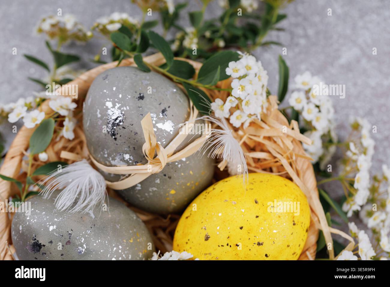 Easter eggs spring decoration in rustic basket Stock Photo