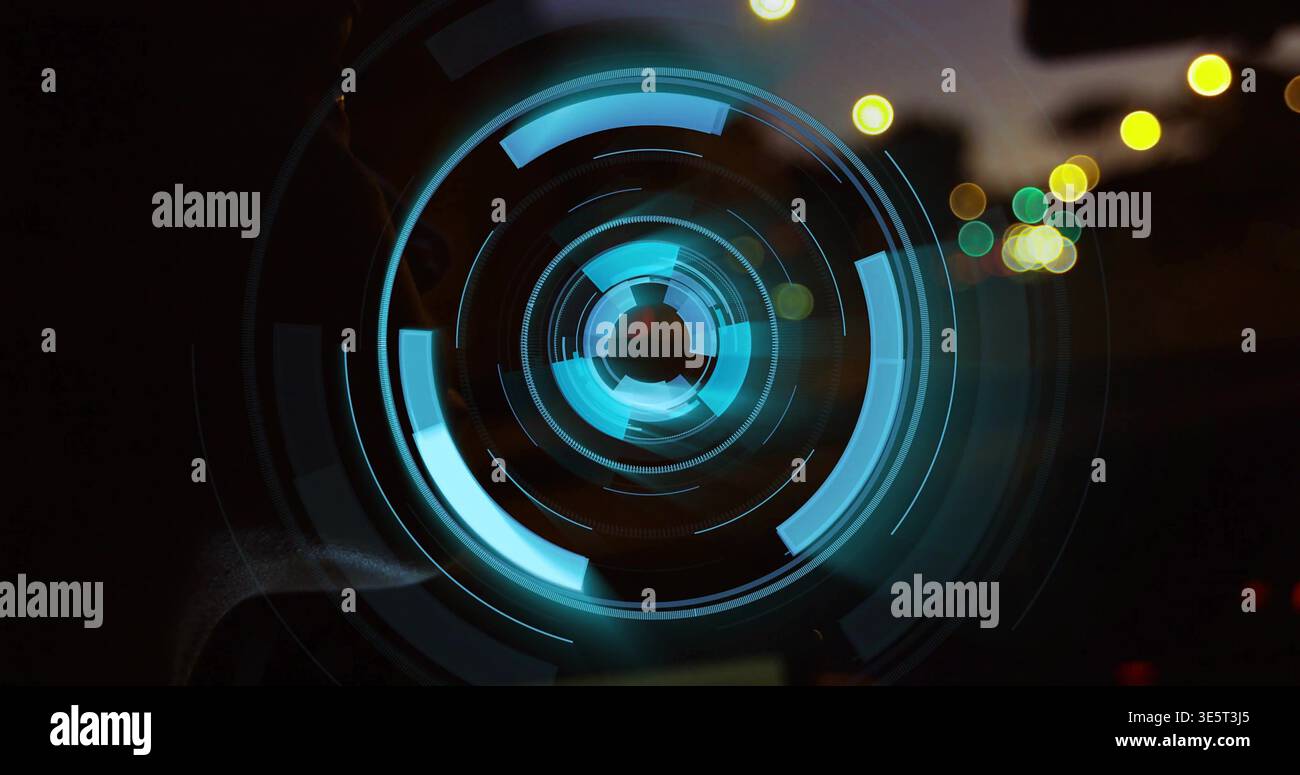 Glowing central cyan teal concentric lens showing segmented arcs, lines in low light with bokeh Stock Photo