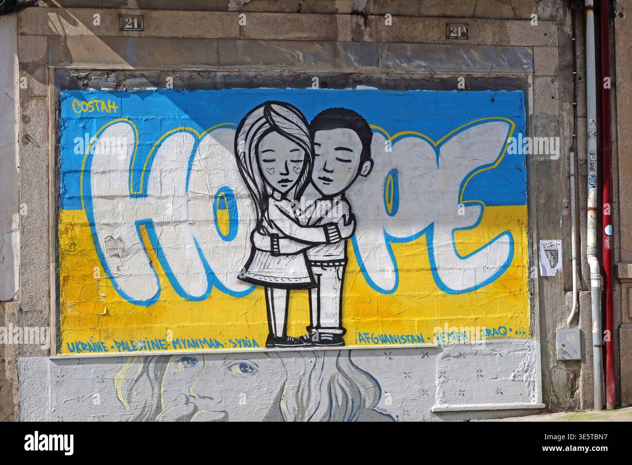 Hope mural in Porto, Portugal, using Ukrainian flag colours and a peace message to express solidarity with people affected by war and conflict. Stock Photo