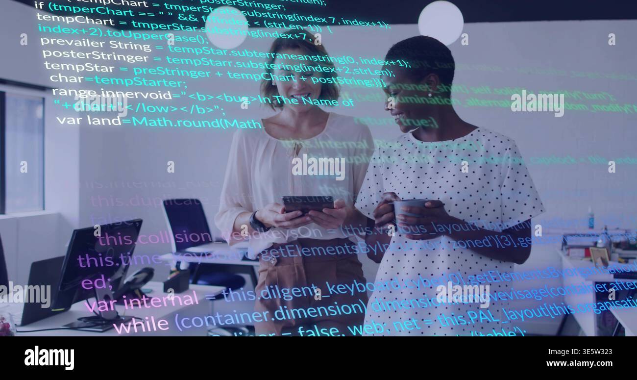 Viewing two women using tablet in office with code overlay, holding mug in work attire Stock Photo