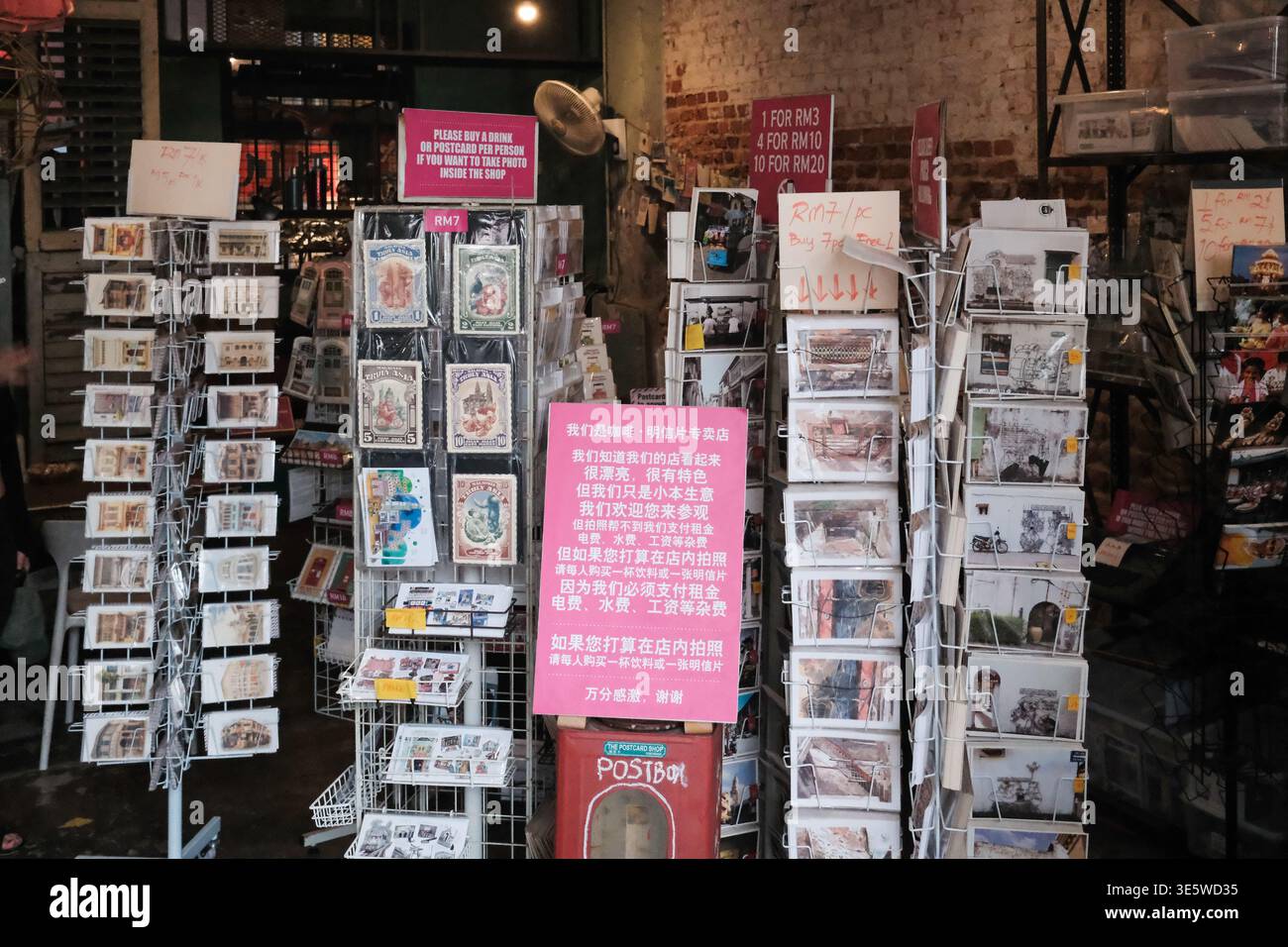 Cozy shop displays greeting cards and whimsical figurines. Metal racks ...