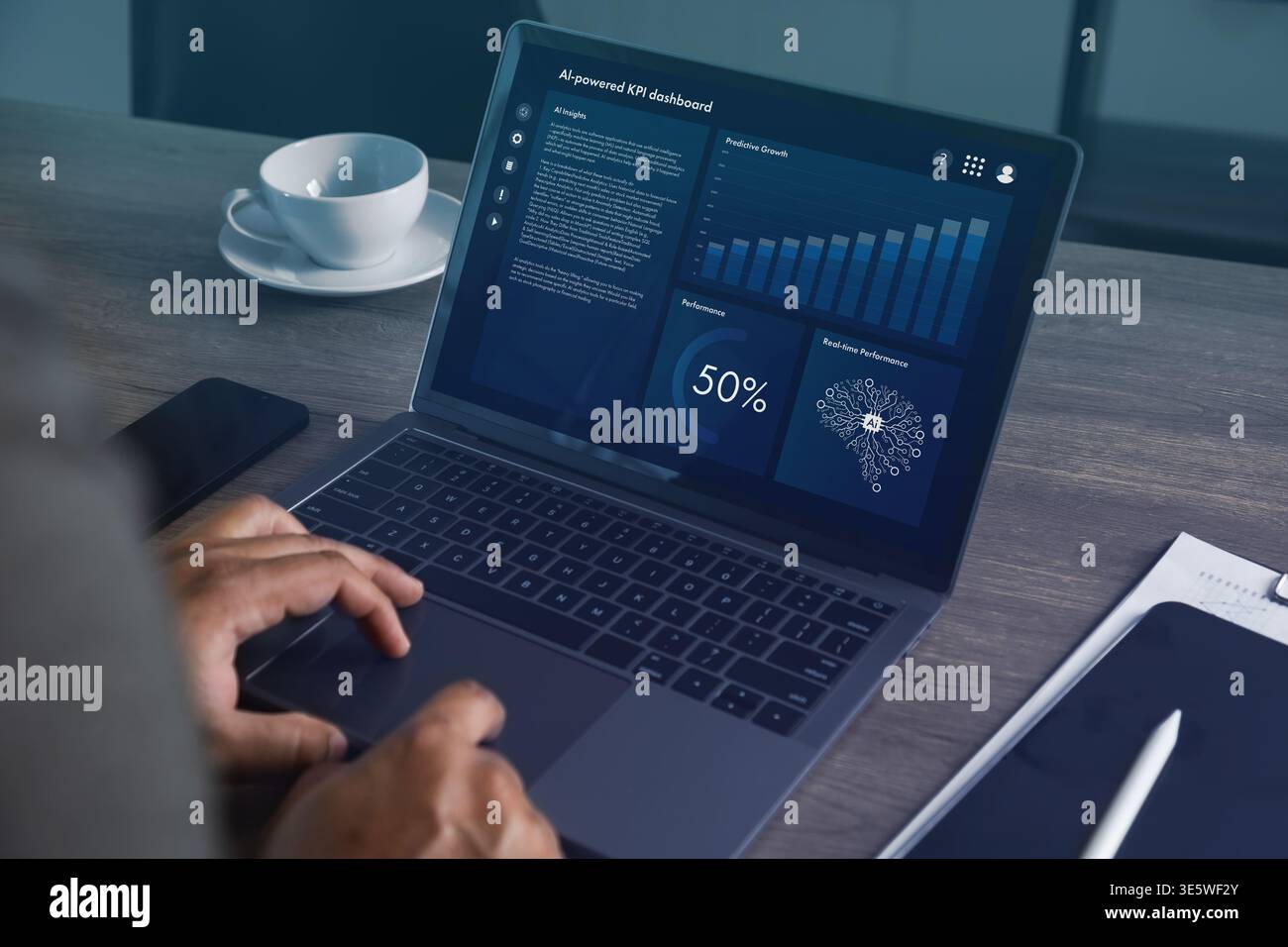 Hands operating laptop with AI powered analytics dashboard featuring charts, graphs, and performance indicators in office setting, representing data m Stock Photo