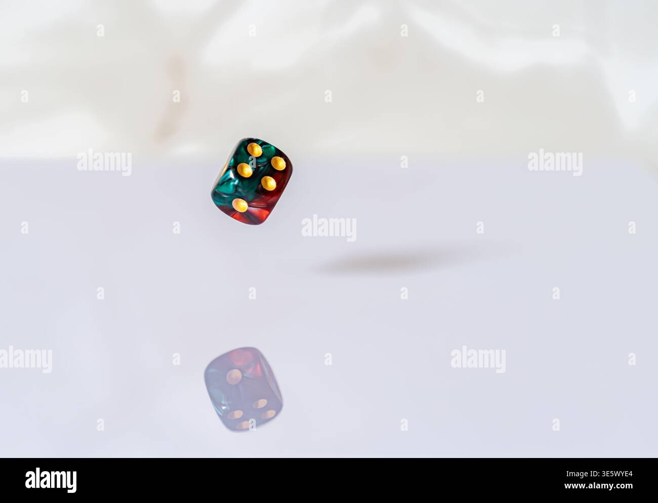 Floating magical dice with reflection Stock Photo