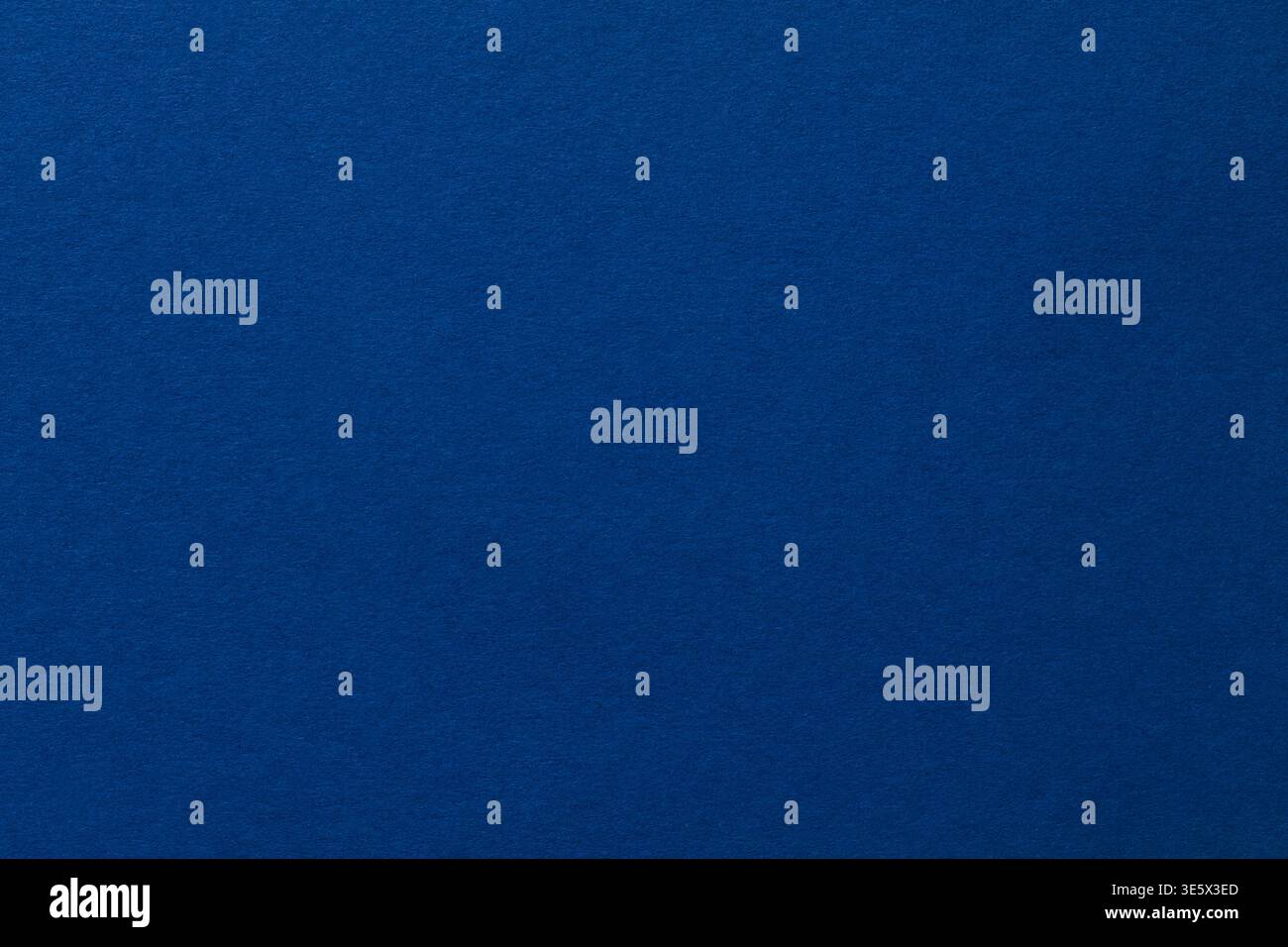Deep blue textured paper background with subtle gradient for versatile design and copy space Stock Photo
