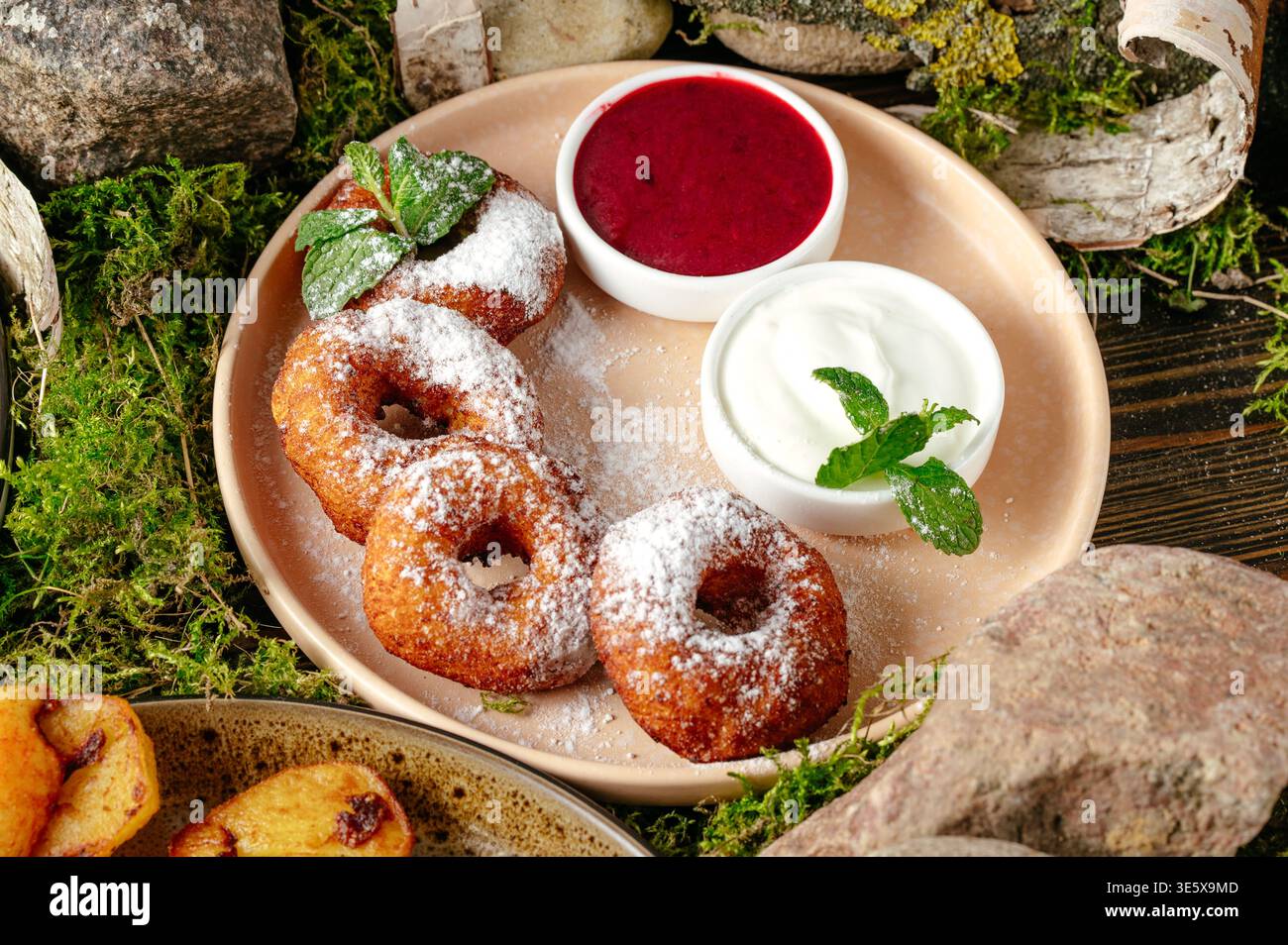 donuts in powdered sugar and jam Stock Photo