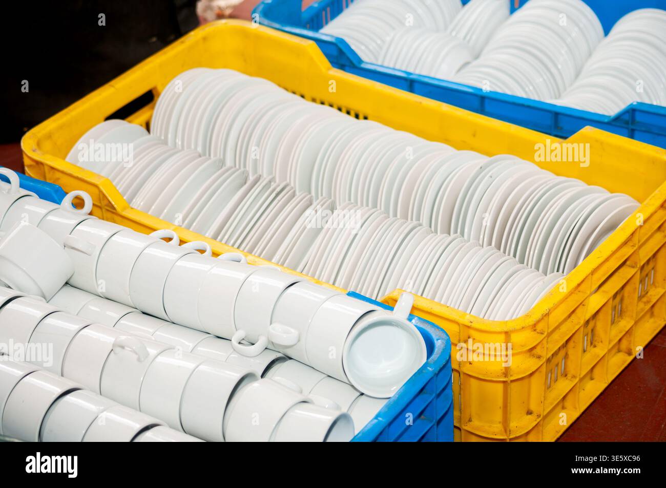 Stacked white ceramic cups and plates Stock Photo