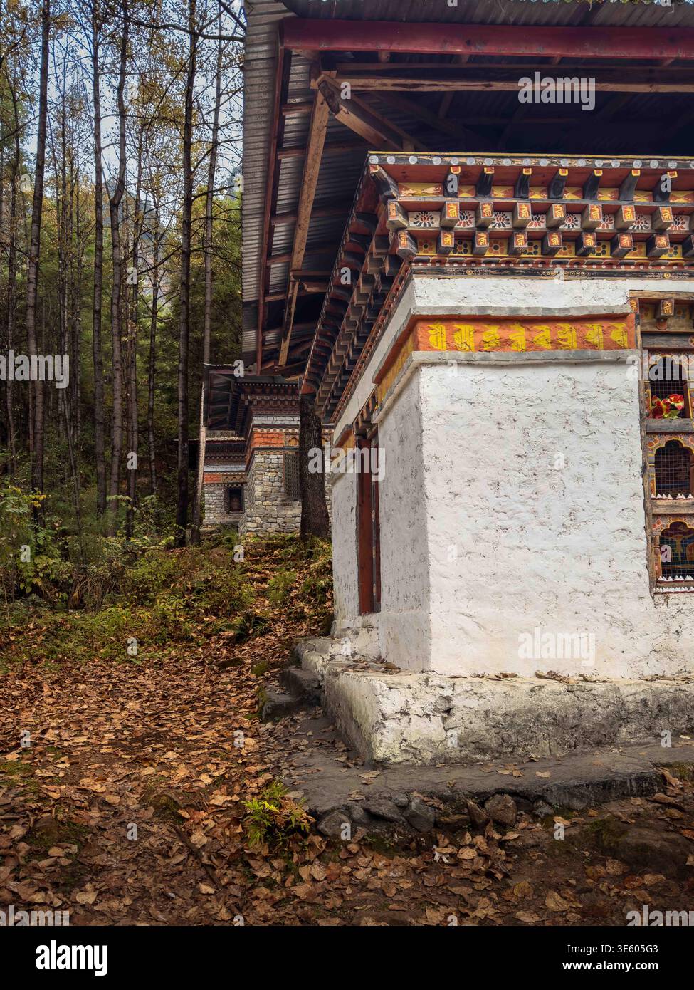 Row of large chortens at the foot of the mountain leading up to the Tigers Nest Temple, Paro, Bhutan - Smartphone Captured Stock Image