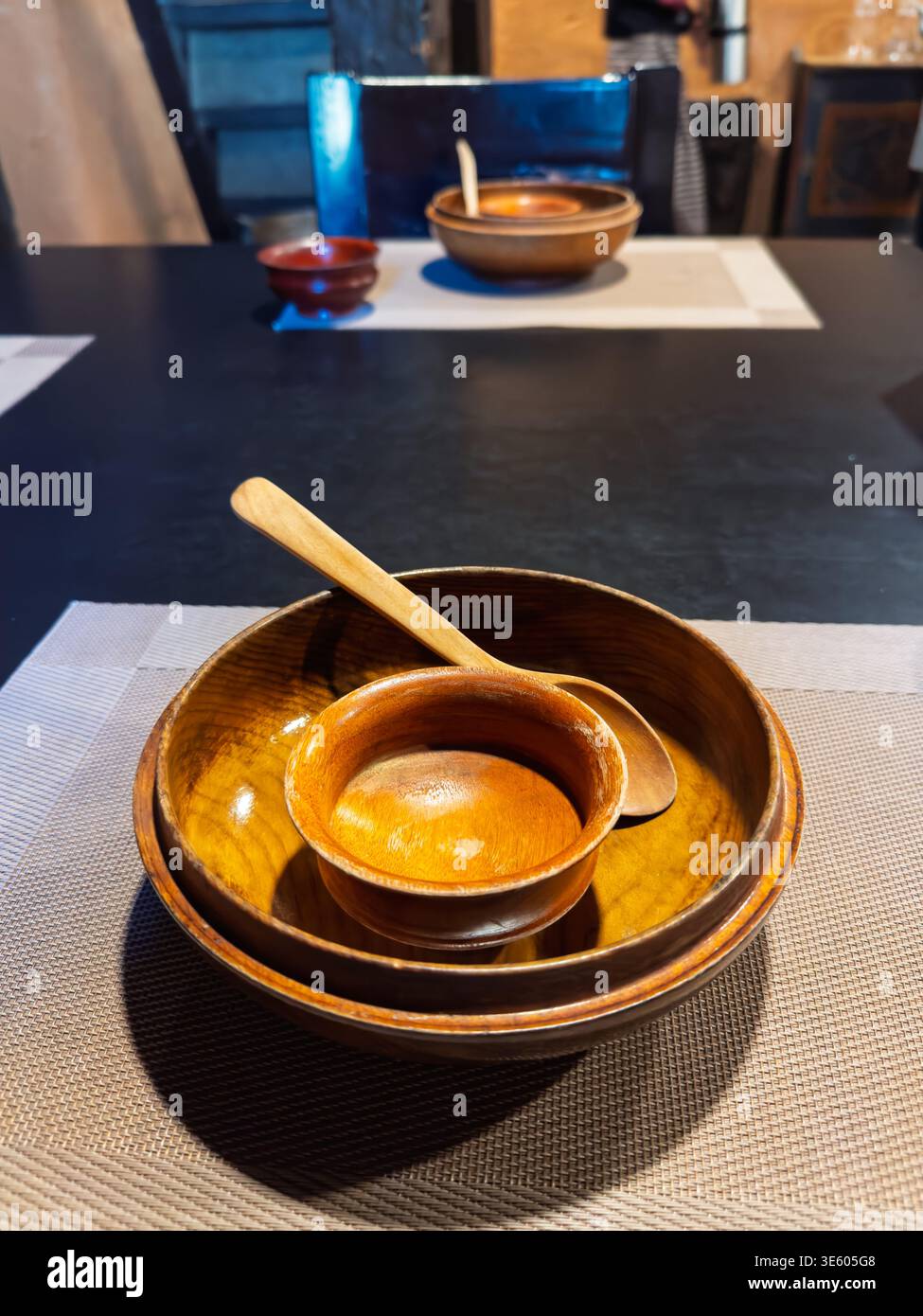 Set of wooden bowls in a Bhutanese cafe. - Smartphone Captured Stock Image