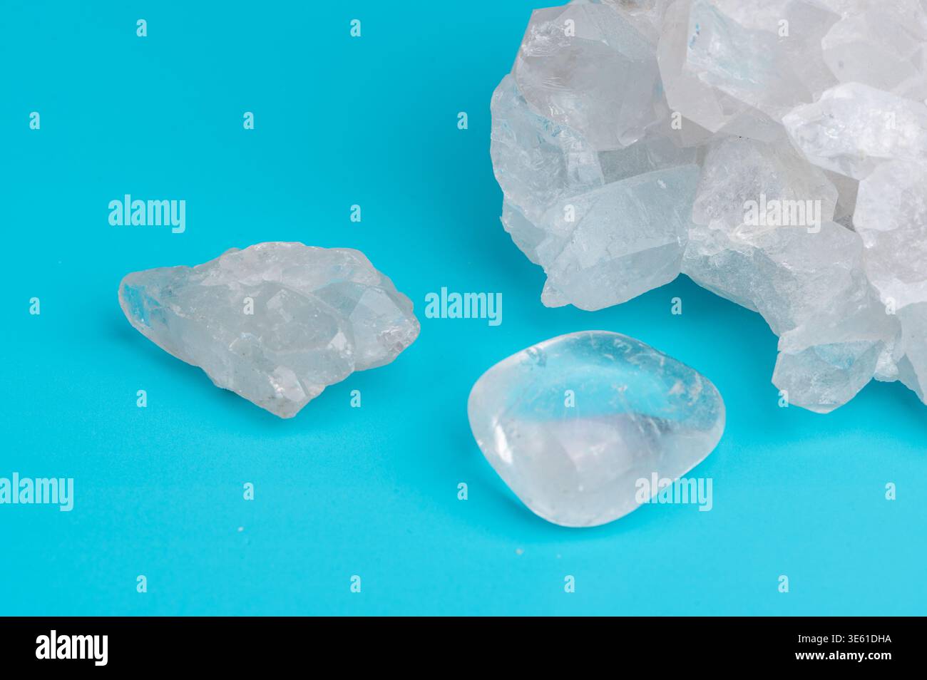 rock crystals are placed on a blue surface Stock Photo
