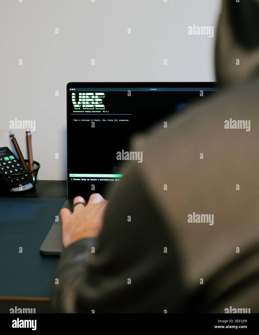 Middle Aged Man Turns Hacker in Hoodie After Using Vibe Coding Command Line Interface Artificial Intelligence Large Language Model Assistant Concept Stock Photo
