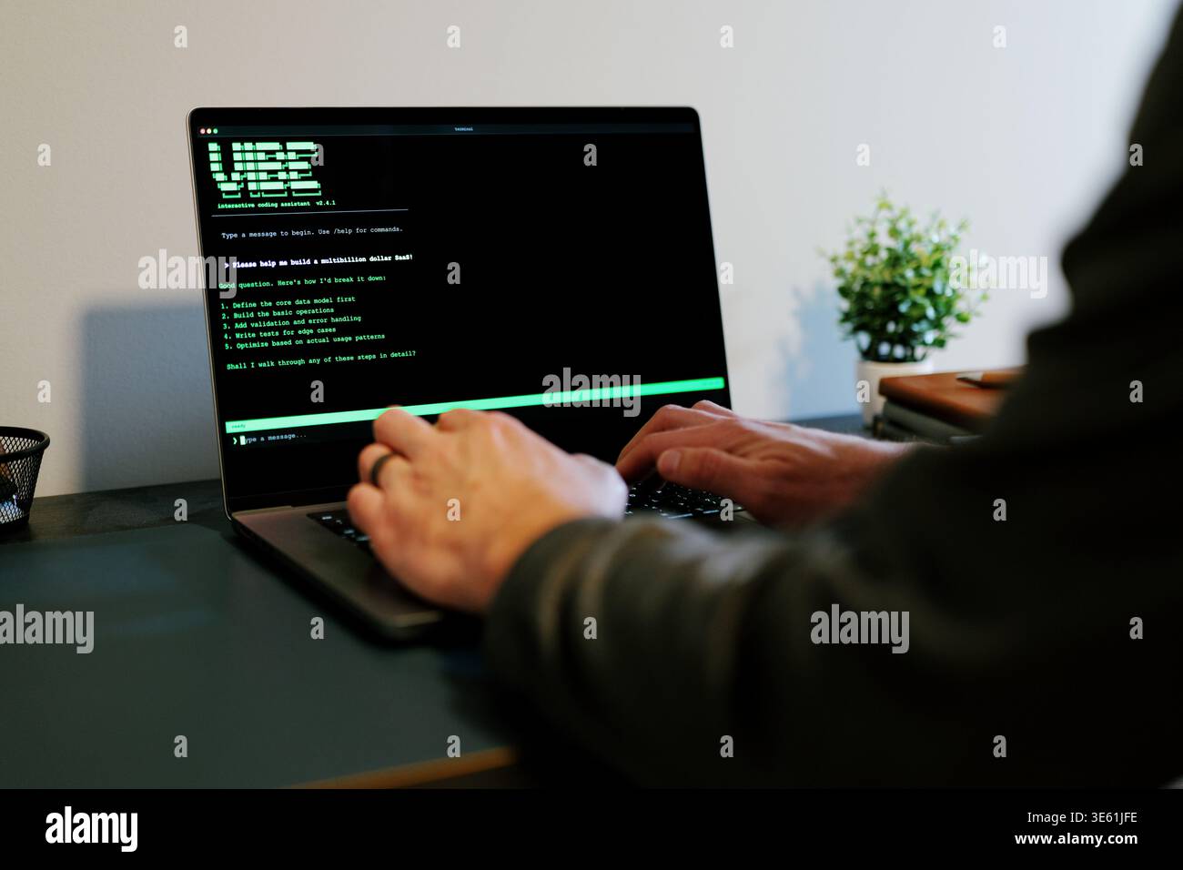Middle Aged Man Turns Hacker in Hoodie After Using Vibe Coding Command Line Interface Artificial Intelligence Large Language Model Assistant Concept Stock Photo