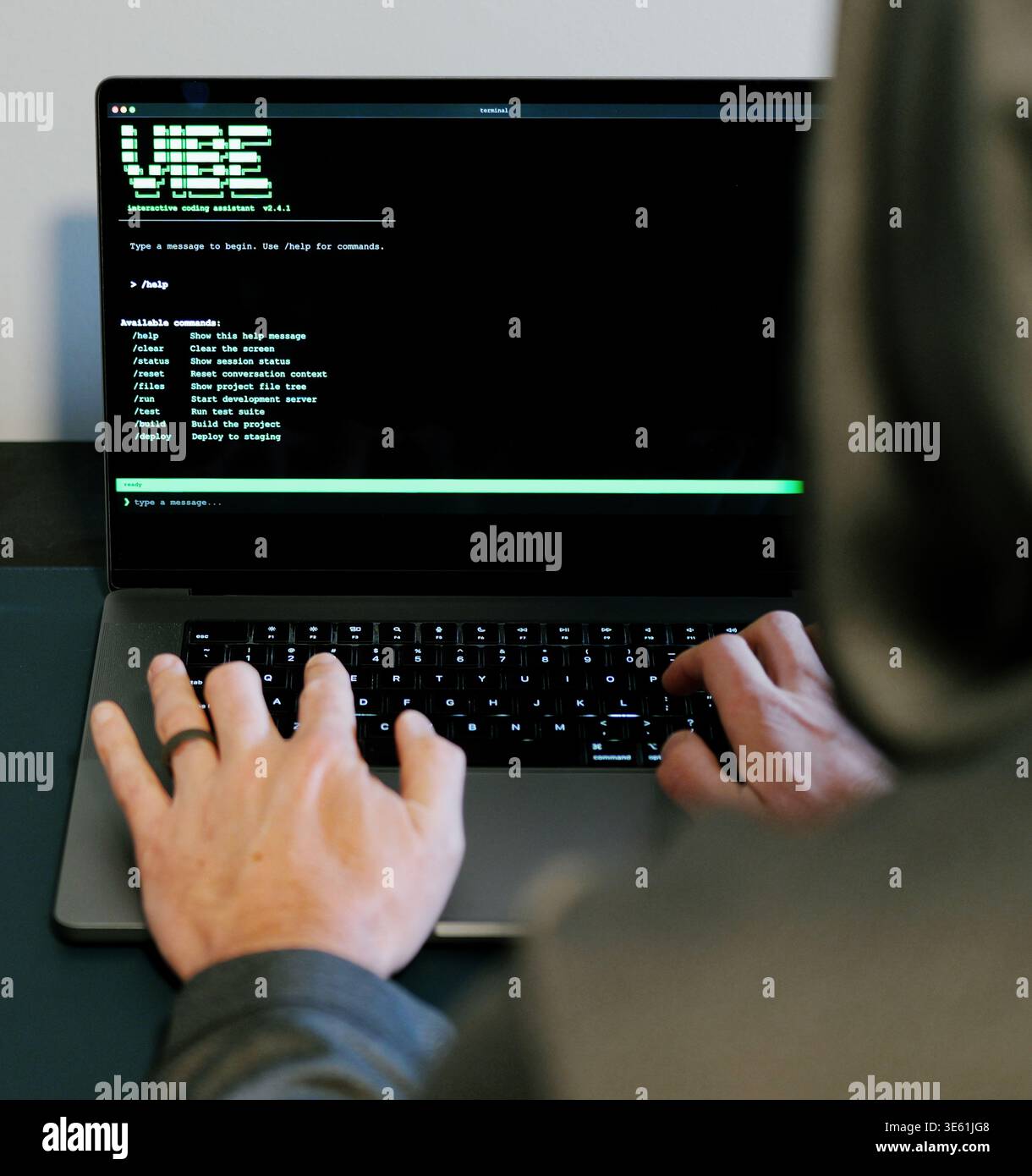 Middle Aged Man Turns Hacker in Hoodie After Using Vibe Coding Command Line Interface Artificial Intelligence Large Language Model Assistant Concept Stock Photo