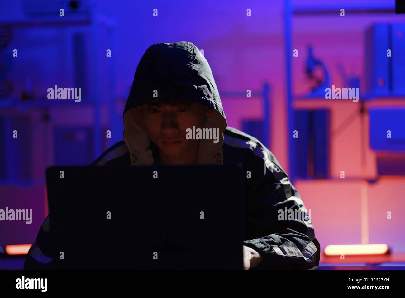 Hacker executing cyberattack representing data breach, system infiltration, and cybersecurity threat Stock Photo