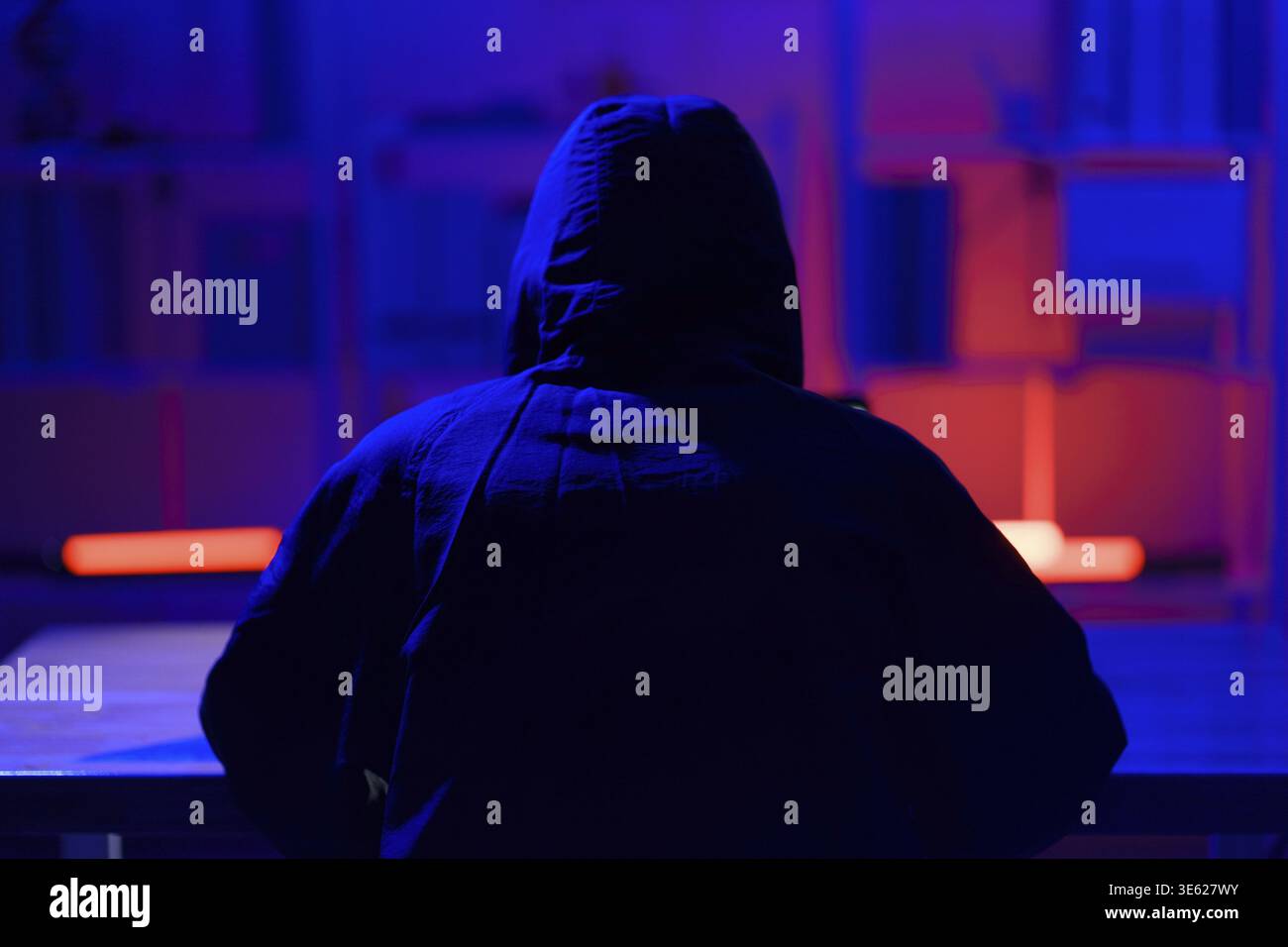 Hacker executing cyberattack representing data breach, system infiltration, and cybersecurity threat Stock Photo