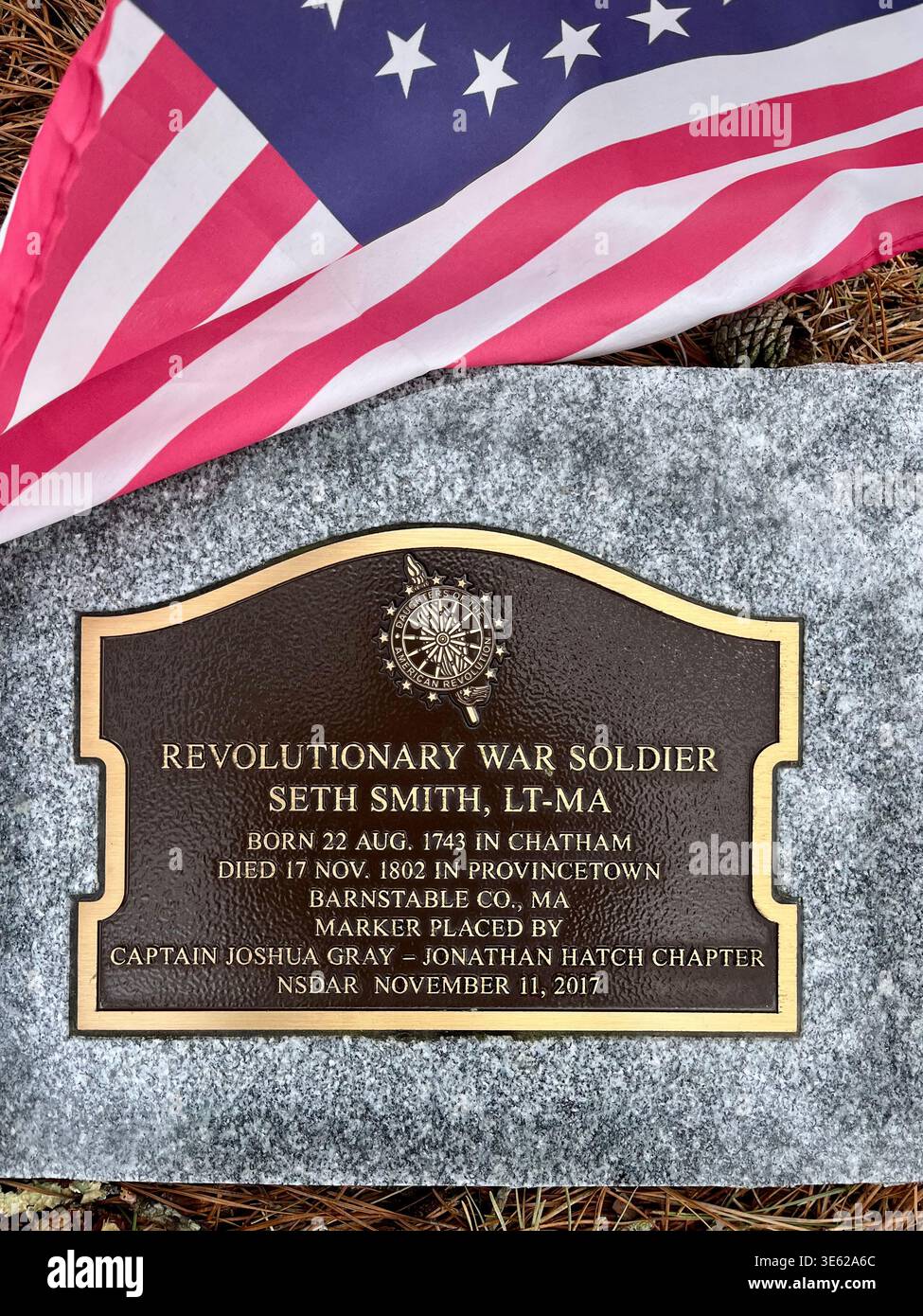 Plaque in Provincetown’s oldest cemetery, Winthrop Street Cemetery, memorializing Revolutionary War soldier. - Smartphone Captured Stock Image
