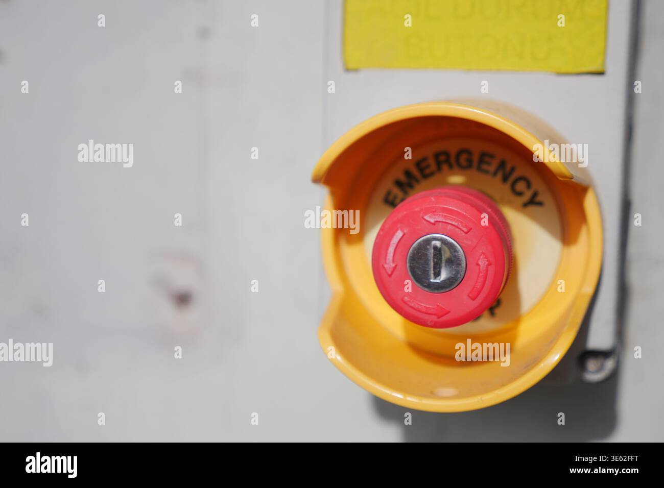 Red emergency button in a control panel at a facility Stock Photo - Alamy