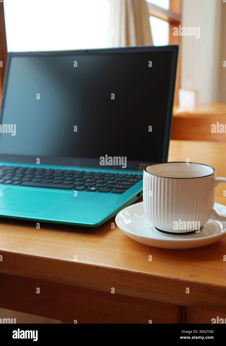 Laptop and Coffee, Calm Start to Digital Work Stock Photo