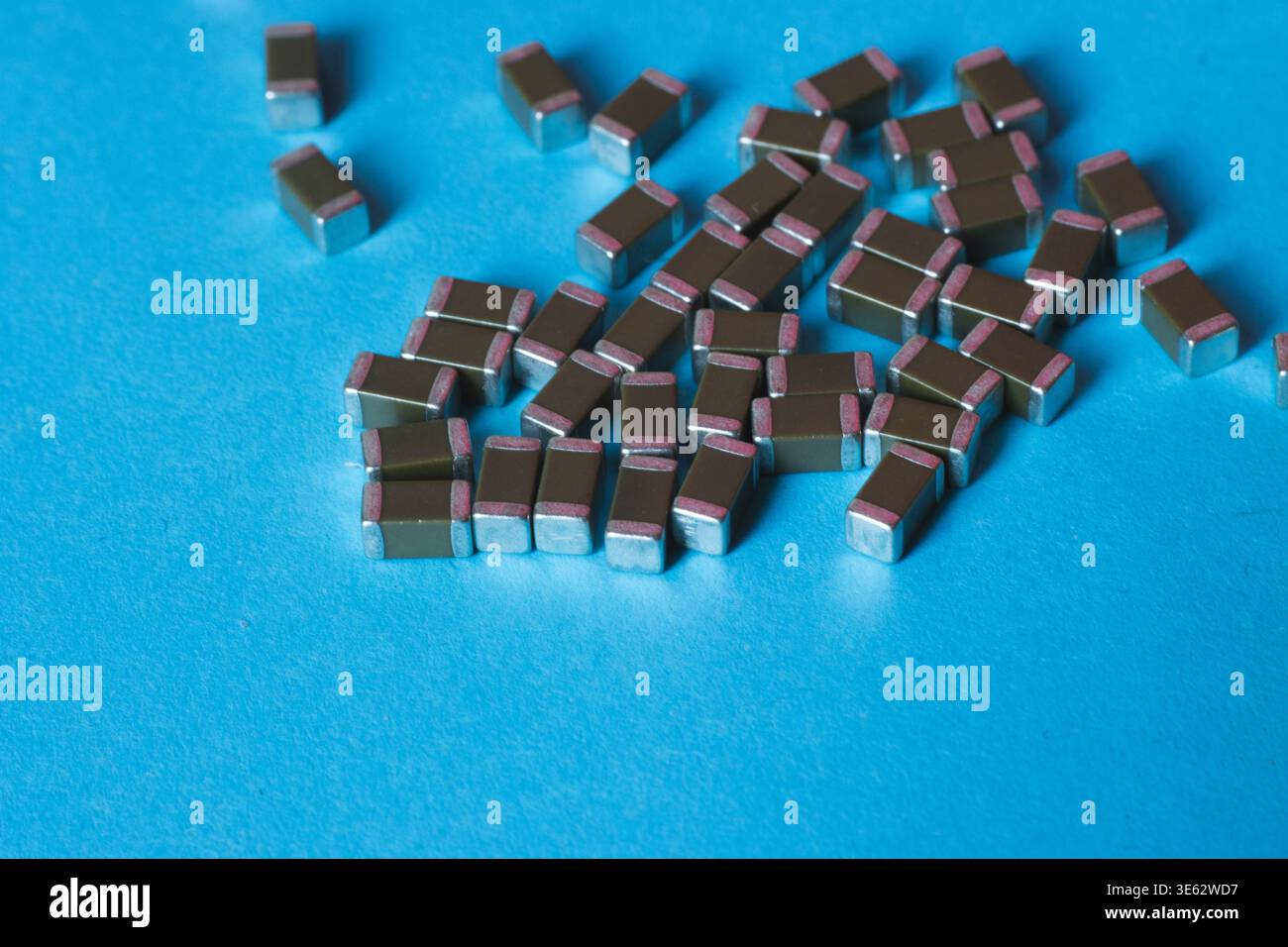 Surface mount ceramic capacitors on blue background Stock Photo