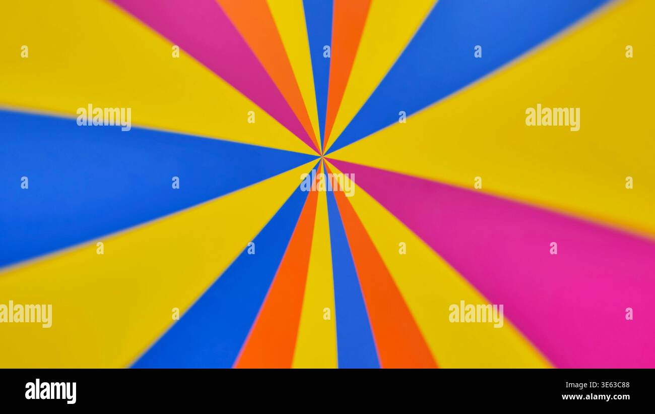 Vibrant abstract background with a colorful radial sunburst pattern Stock Photo